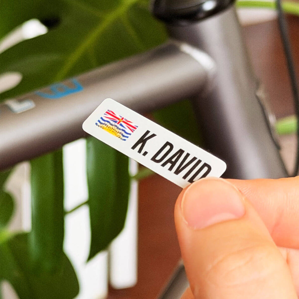 Custom British Columbia name bar vinyl sticker in front of a gravel bike frame