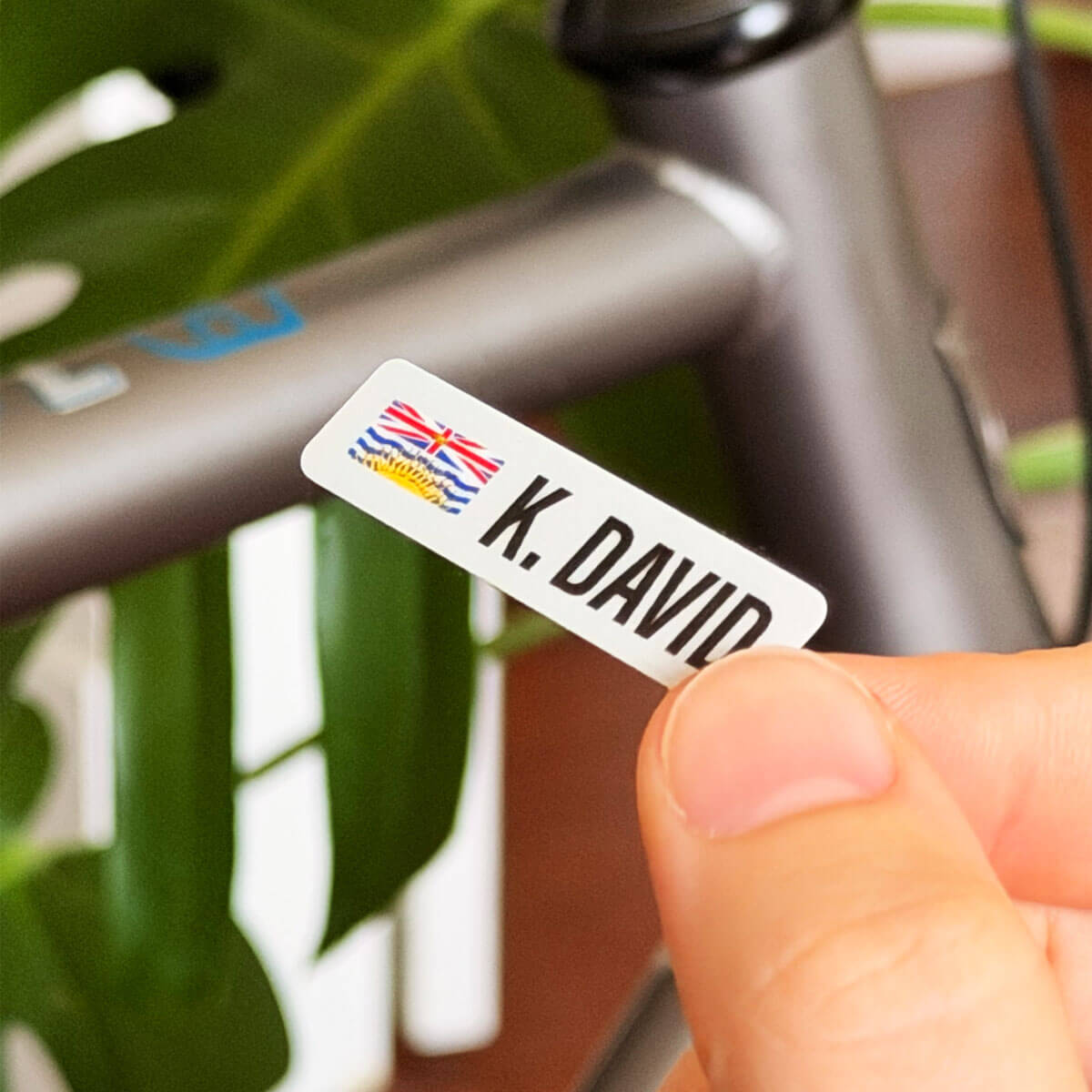 Custom British Columbia name bar vinyl sticker in front of a gravel bike frame