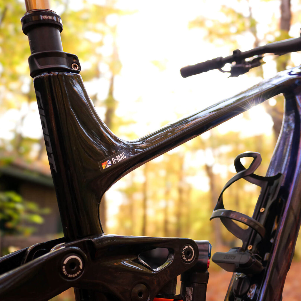 Custom split flag vinyl name bar decal on mountain bike frame