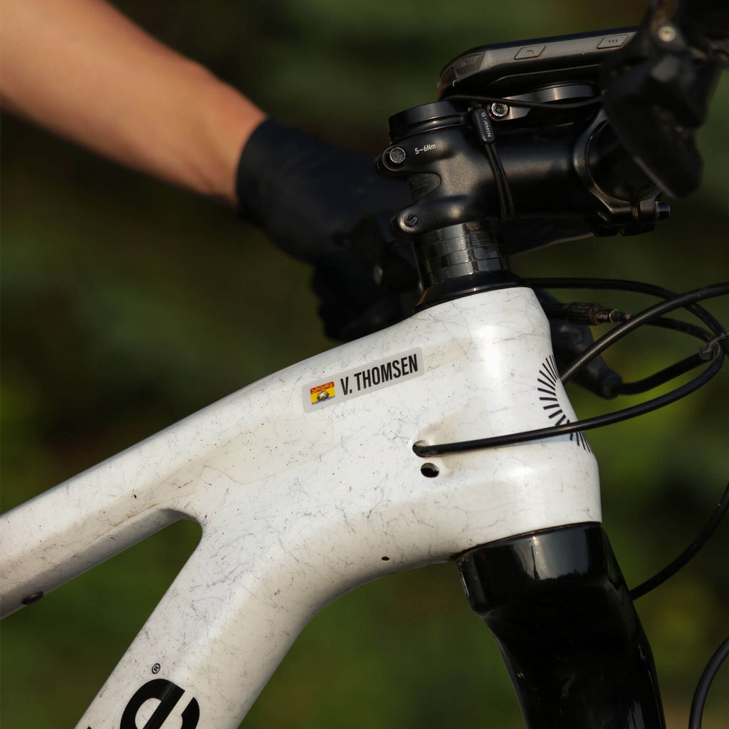Custom V. Thomsen New Brunswick vinyl name bar decal on a mountain bike frame
