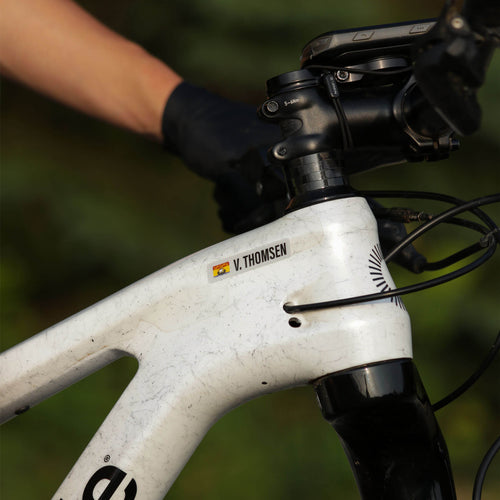 Custom V. Thomsen New Brunswick vinyl name bar decal on a mountain bike frame
