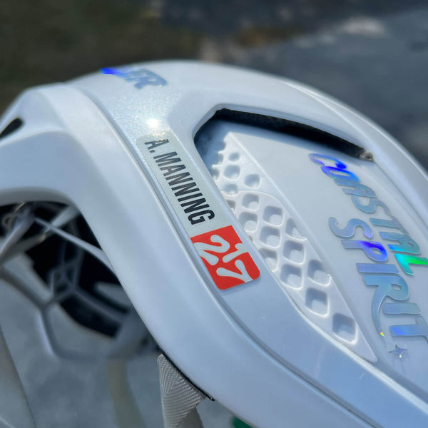 Custom namebar featuring club logo on a white Lazer cycling helmet